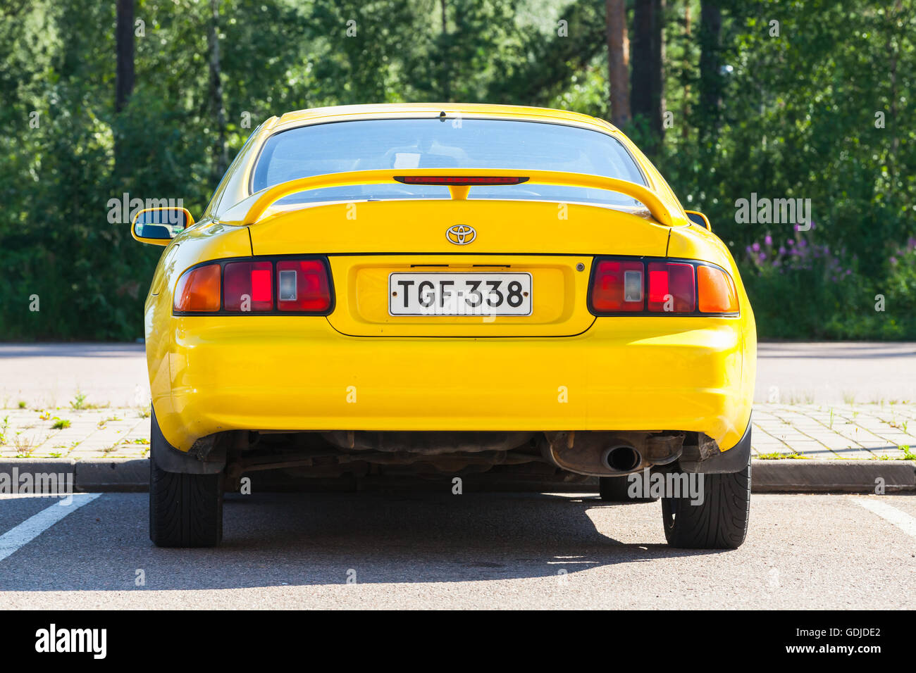 Kotka, Finland - July 16, 2016: Bright Yellow Facelift Toyota Celica GT liftback T200 model of 1994-1999, close up rear view Stock Photo
