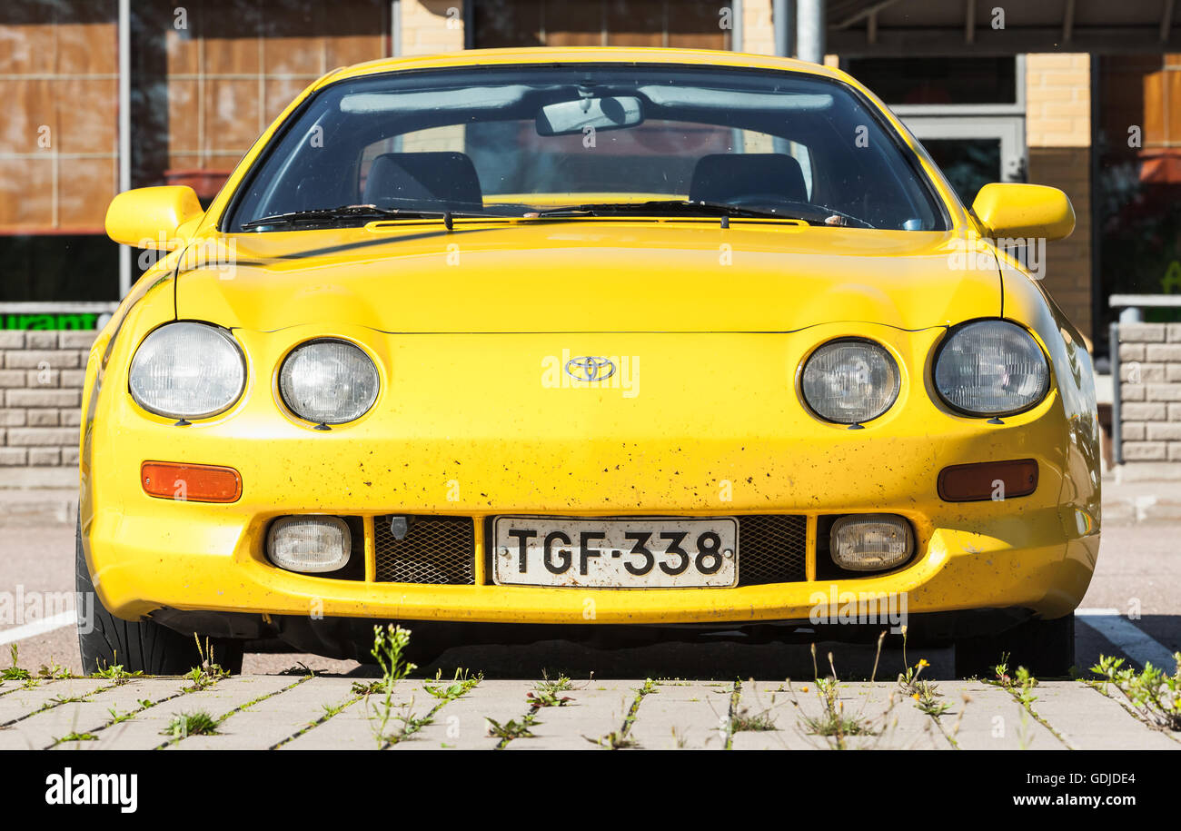 Kotka, Finland - July 16, 2016: Bright Yellow Facelift Toyota Celica GT liftback T200 model of 1994-1999, closeup front view Stock Photo