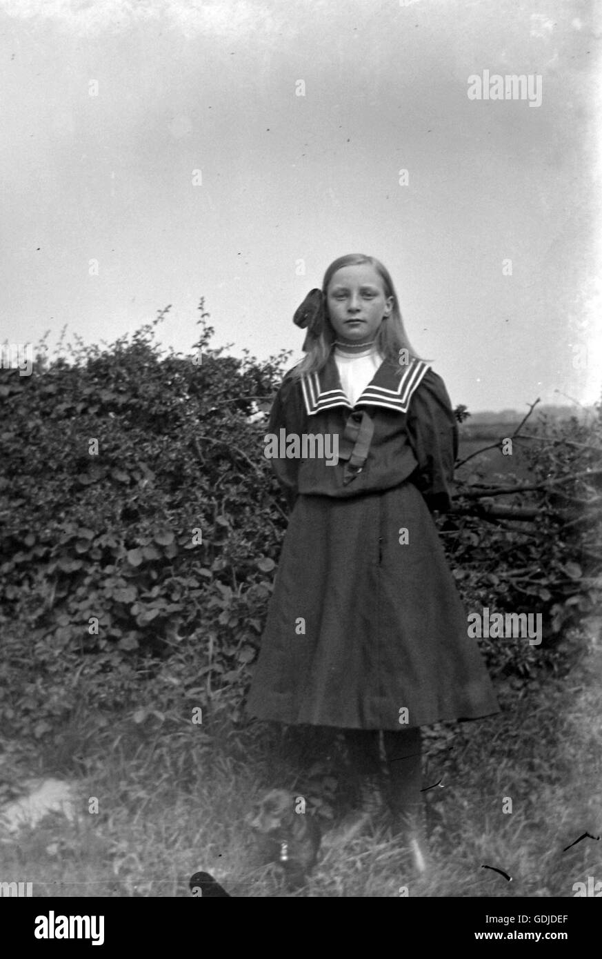 Girl in sailor style dress c1910. Photograph by Tony Henshaw Stock Photo