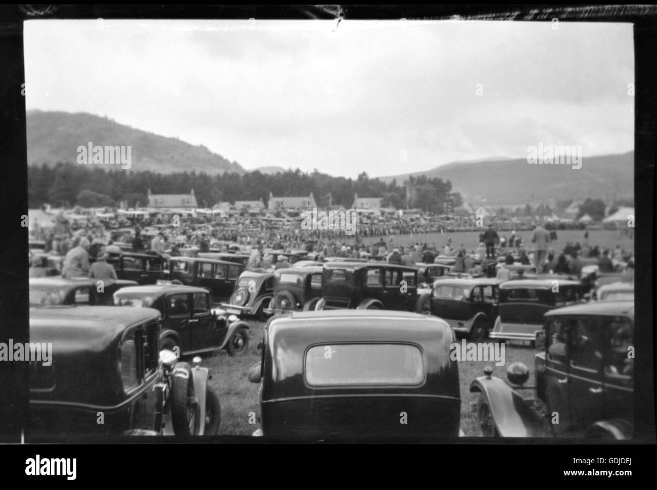 Cars parked at a Highland Games in Scotland, location unknown. c 1935. Photograph by Tony Henshaw Stock Photo