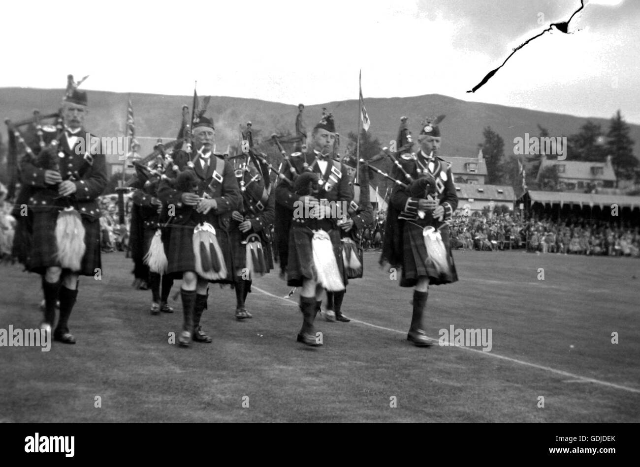Pipers play at a Highland Games in Scotland, location unknown. c 1935.Photograph by Tony Henshaw Stock Photo
