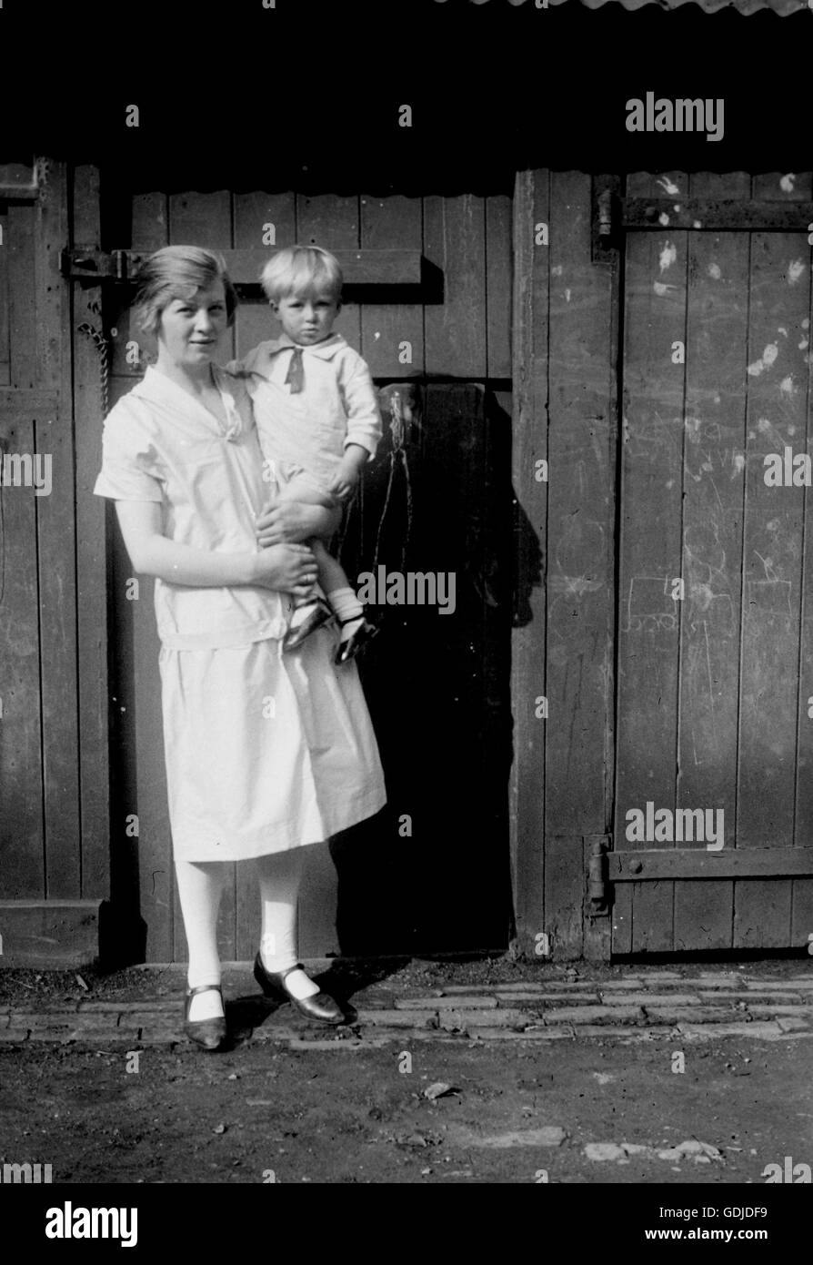 A woman poses with a young boy c1930. Photograph by Tony Henshaw Stock Photo