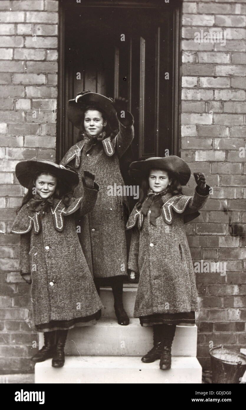 Children smiling and waving in fashionable clothing designs. Social history observations labelled Mr Frith of Rotherham Photographic Society c1910. Photograph by Tony Henshaw Stock Photo