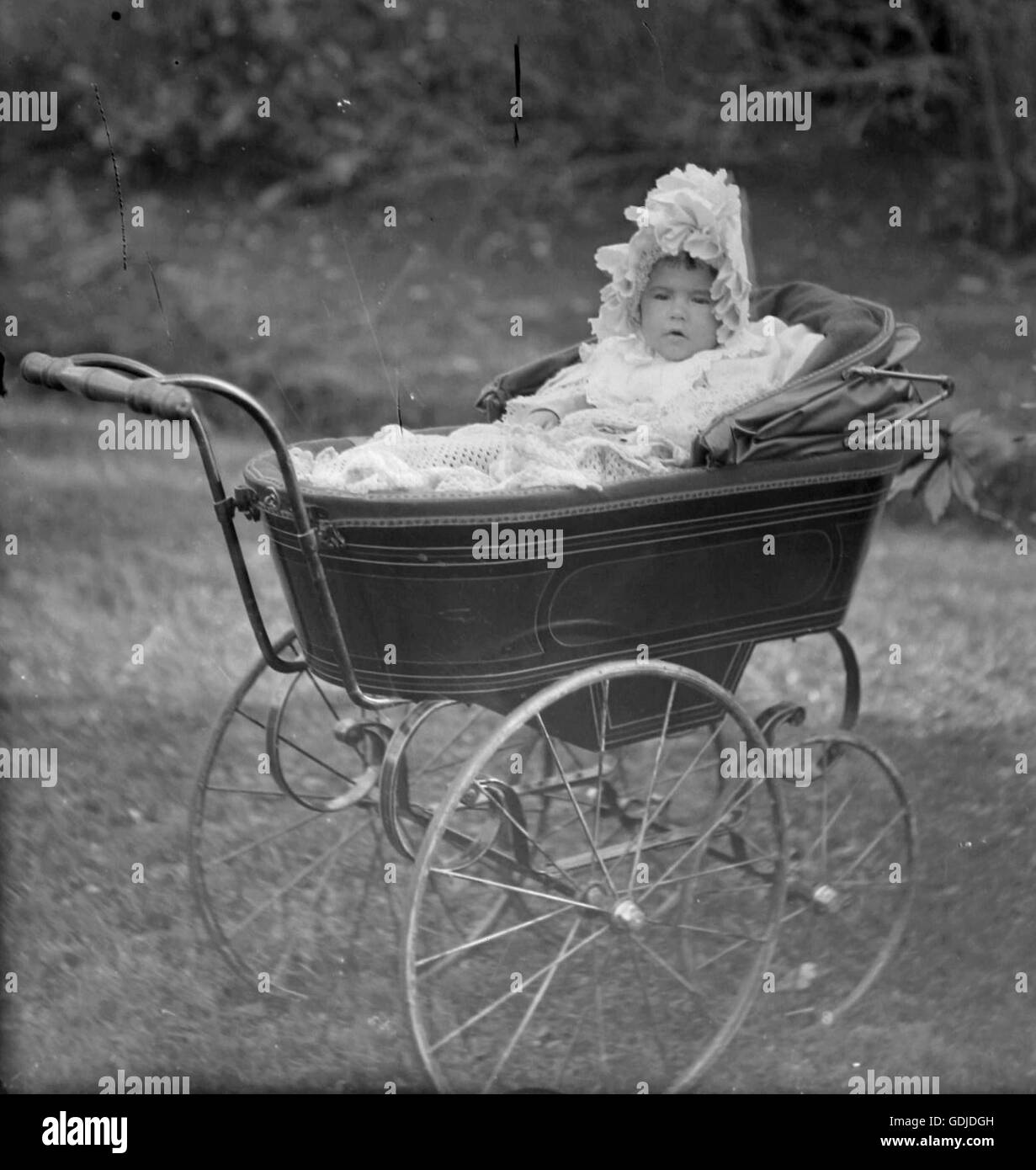 Victorian baby in perambulator. C1890. Photograph by Tony Henshaw Stock Photo