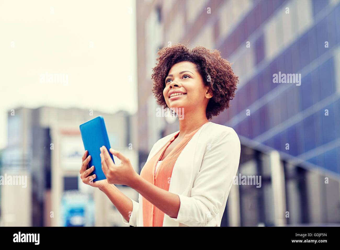happy african businesswoman with tablet pc in city Stock Photo - Alamy
