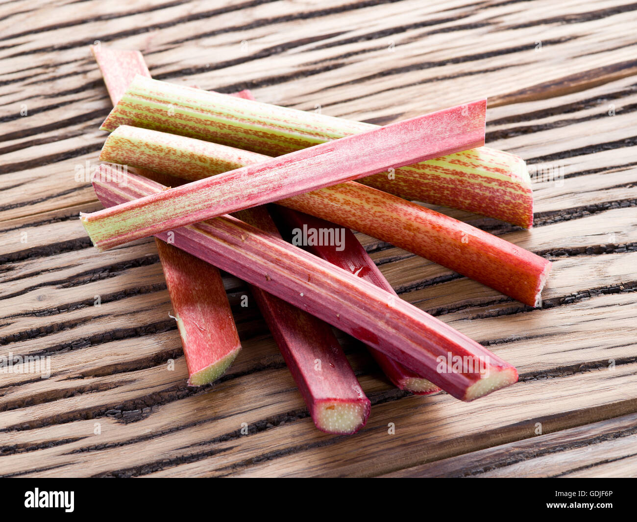 Rhubarb stalks on the wooden table. Stock Photo