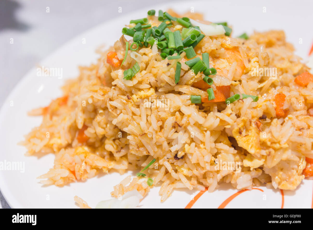 Homemade Chinese fried rice with vegetables, chicken and fried eggs