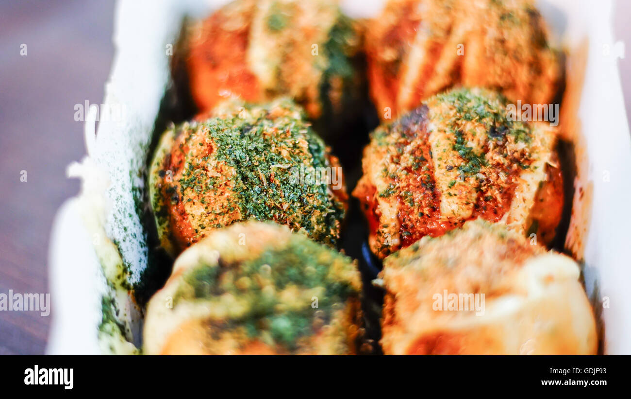 Takoyaki, delicious Japanese style octopus pancake, topping with multiple seasoning, very famous