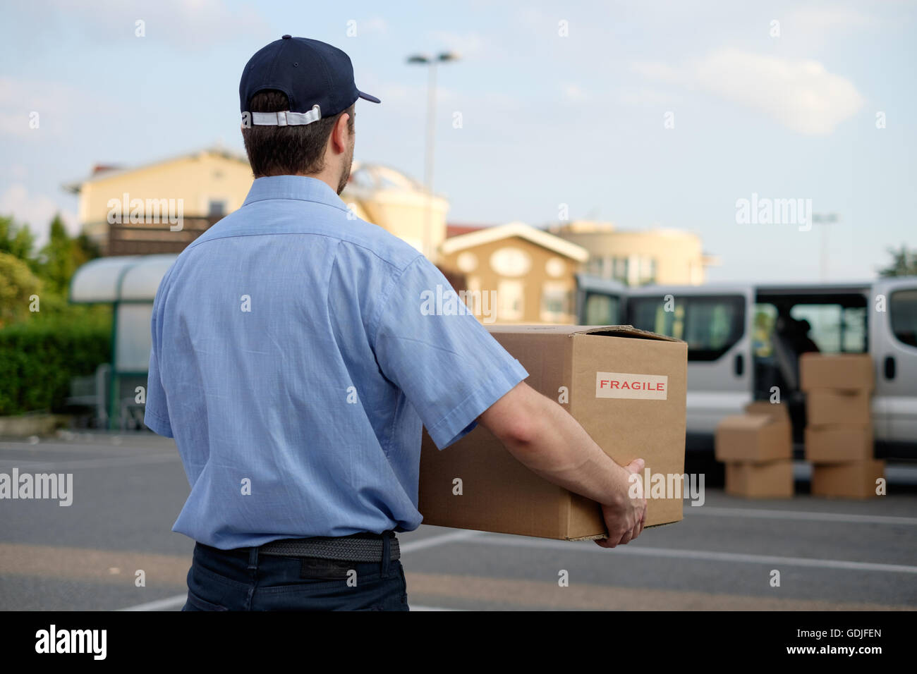 Express courier delivering a box Stock Photo