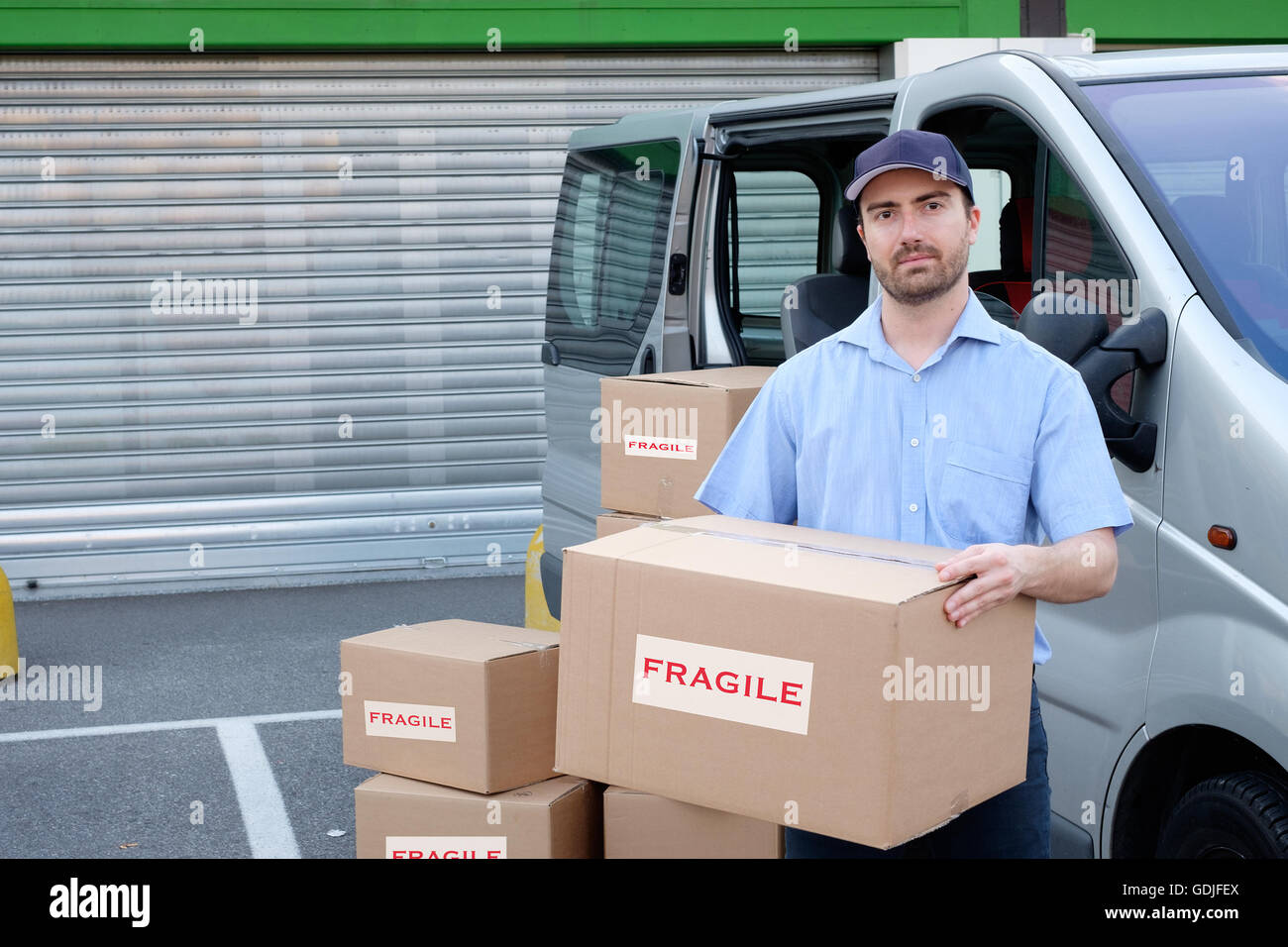 Express courier delivering a box Stock Photo Alamy