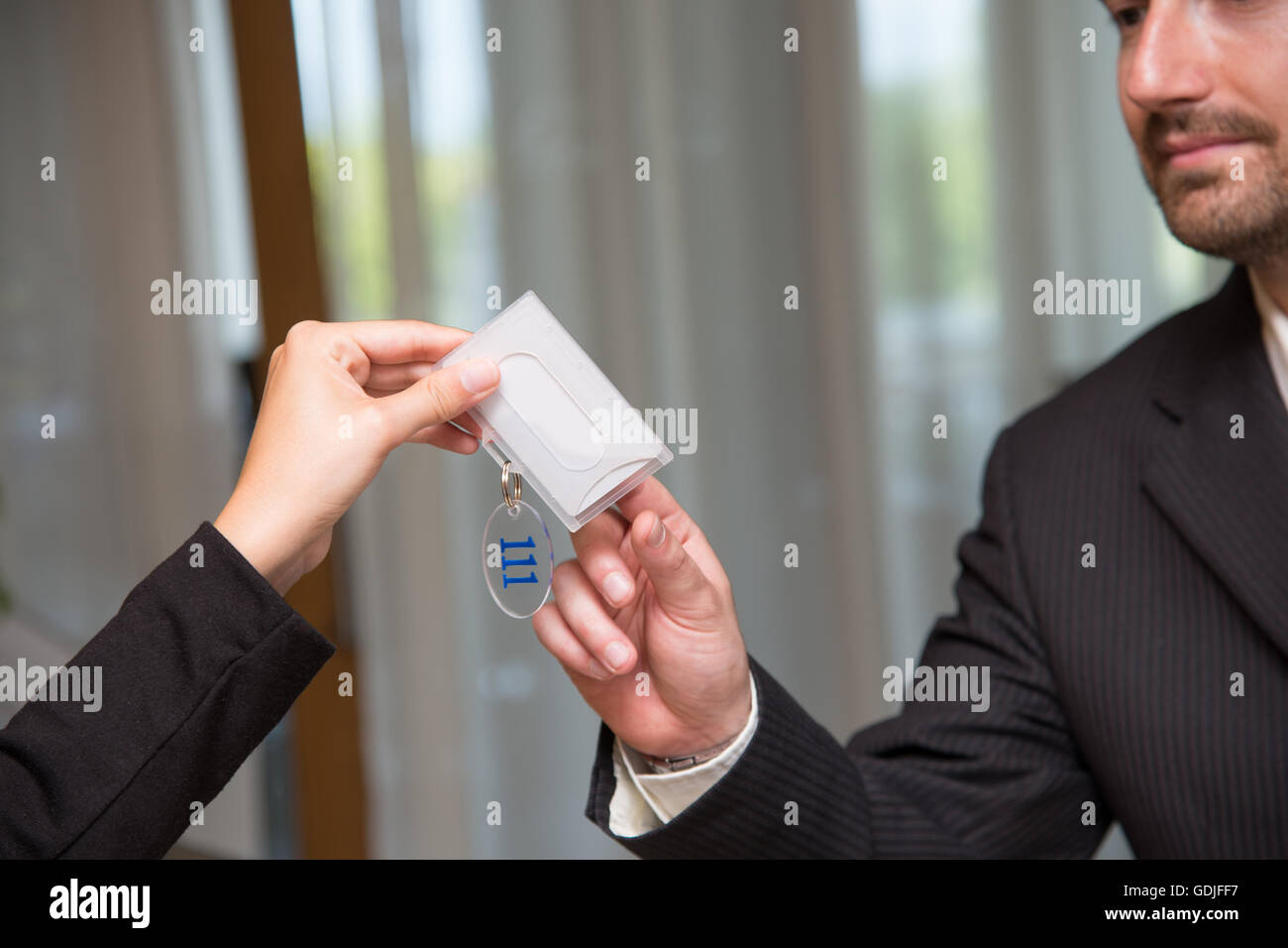 Hotel reception key check-in close up Stock Photo