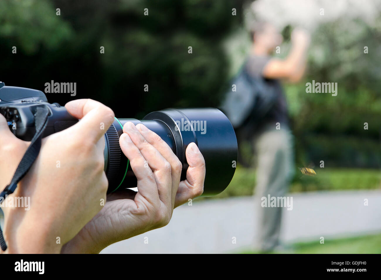 Paparazzi with camera, taking pictures Stock Photo