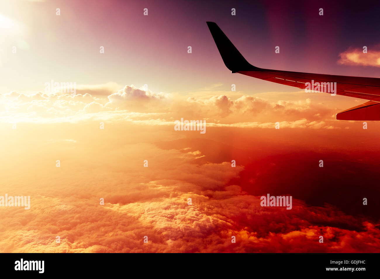Flight above red clouds Stock Photo
