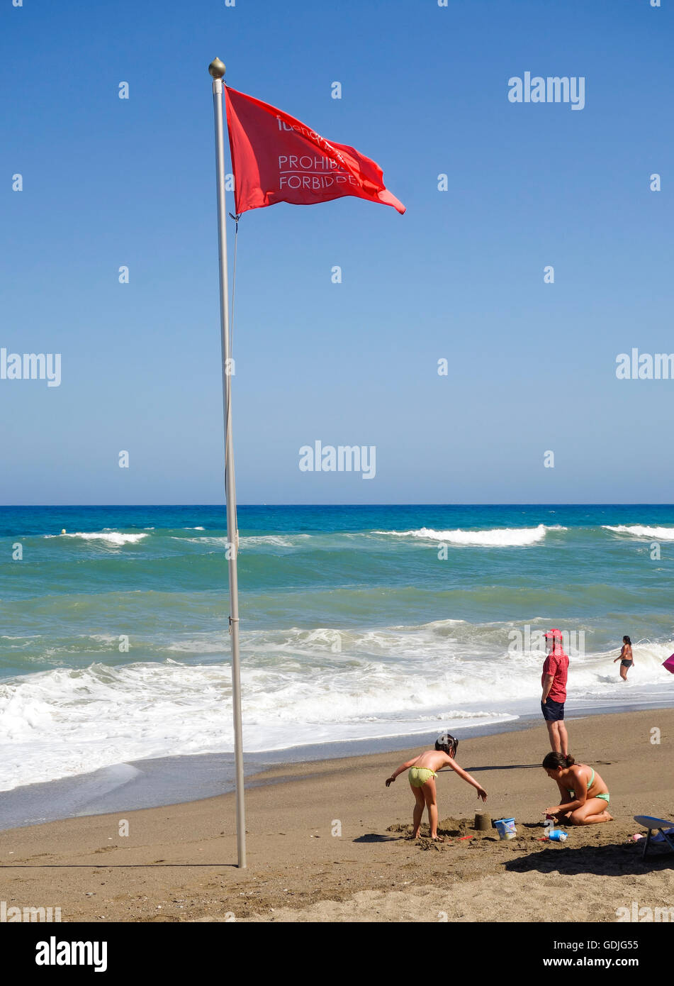 Red flag beach warning, no bathing, on Spanish beach, Fuengirola, Andalusia, Spain. Stock Photo