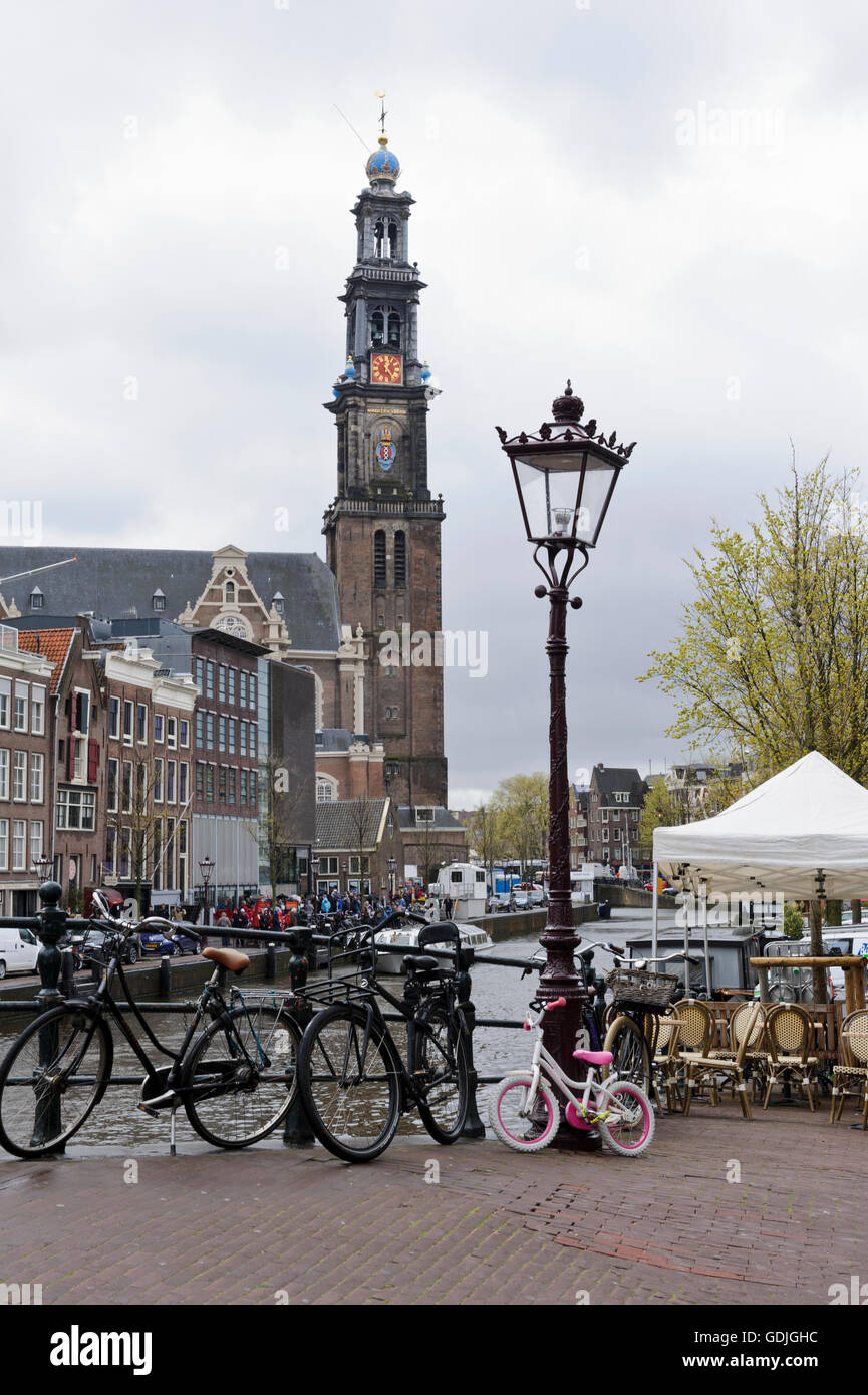 People Queuing Outside The Anne Frank Museum By The Canal With The