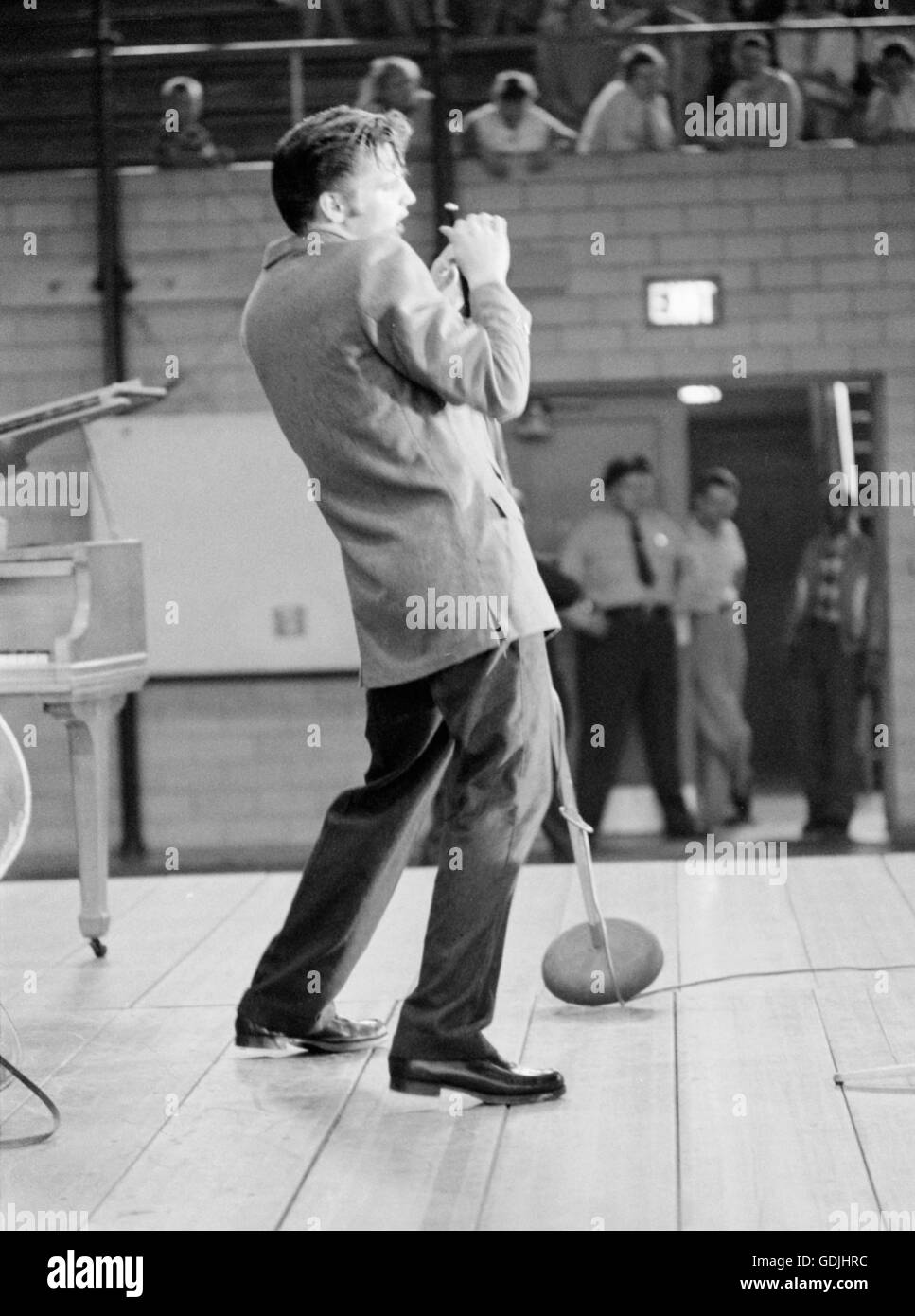 Elvis Presley during a performance at the University of Dayton Fieldhouse, May 27, 1956. Stock Photo