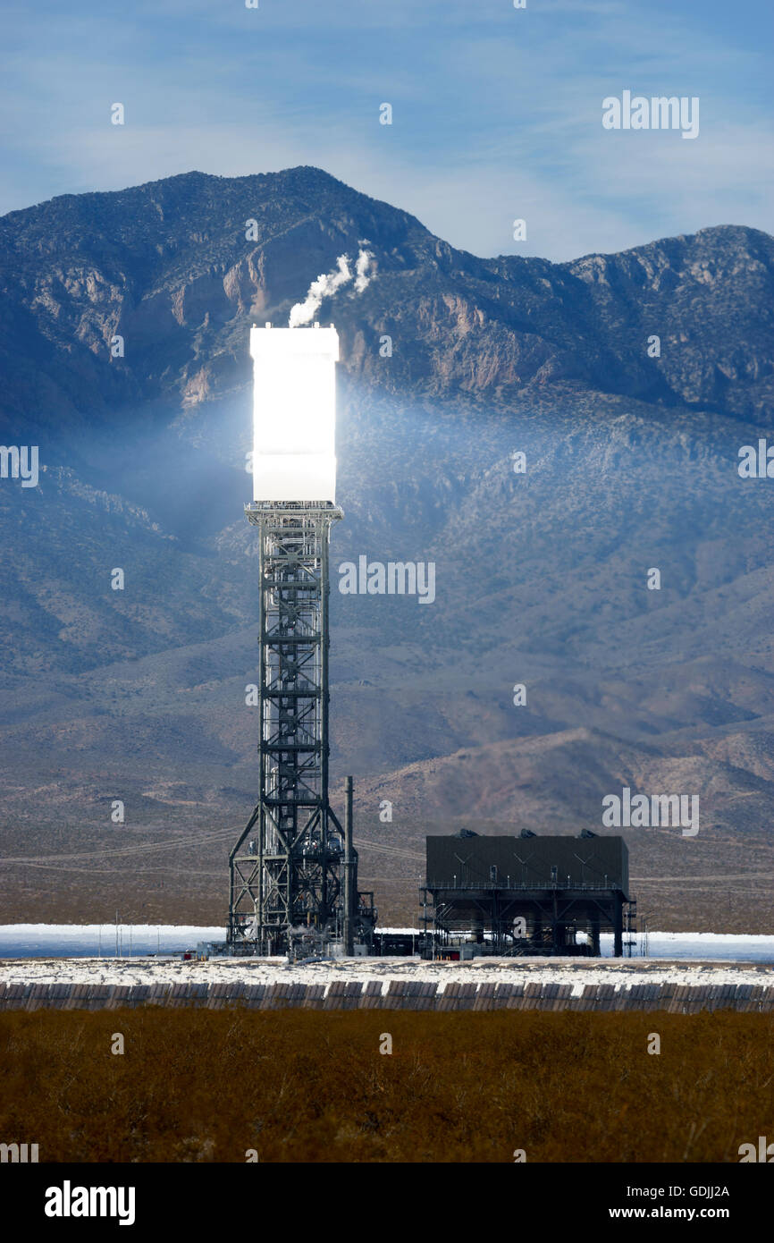 One of the towers of the Ivanpah Solar Electric Generating System  in the Mojave Desert California brightly lit by sunlight Stock Photo