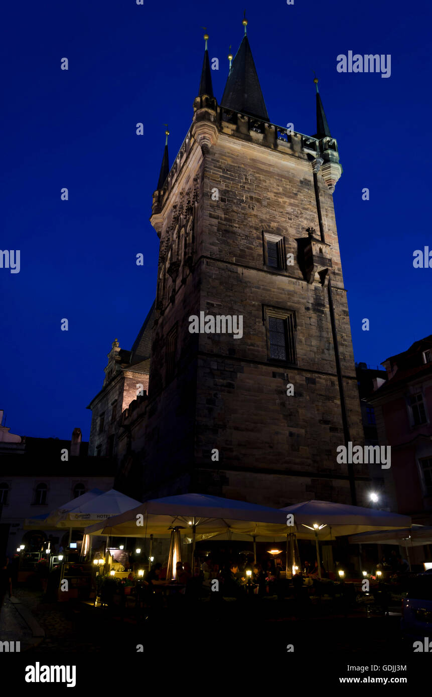 People dining next to the west end of Charles Bridge (Karluv most) in the centre of Prague (Praha) in the Czech Republic. Stock Photo
