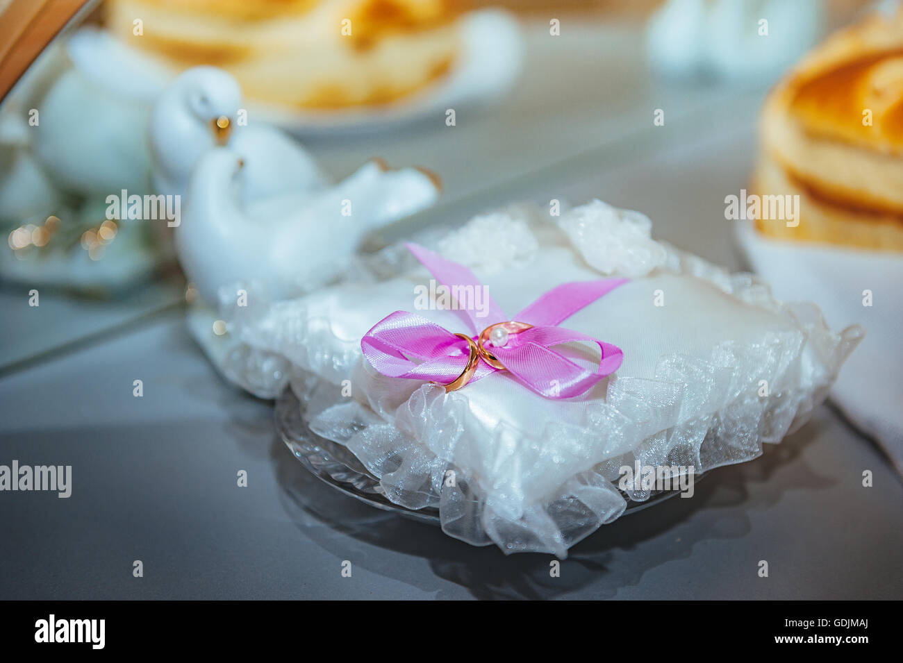 gold wedding rings on the pincushion. gold wedding rings on the