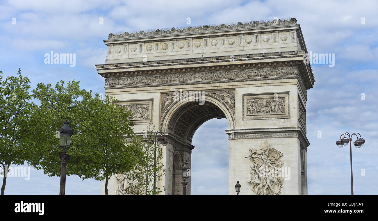Arc de Triumphe monument popular tourist destination Paris with blue cloudy sky Stock Photo