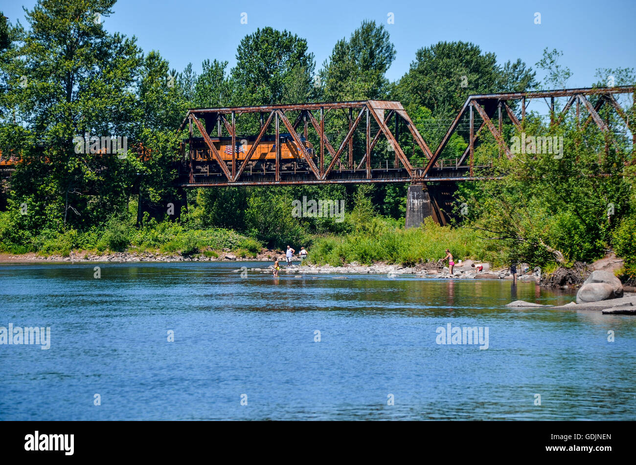 Sandy River scene in Troutdale Oregon, with train on trestle Stock