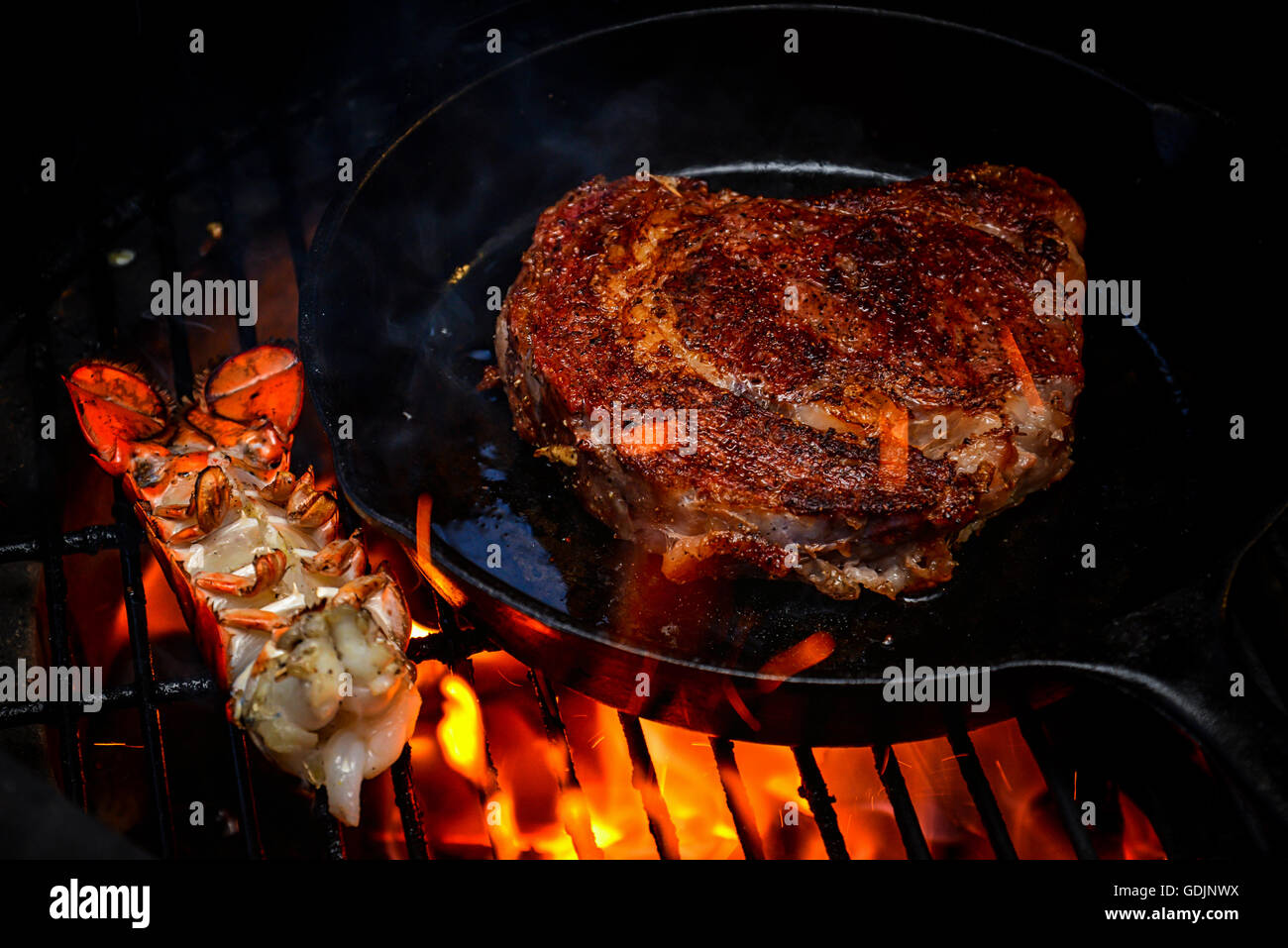 Steak and lobster on the grill Stock Photo Alamy