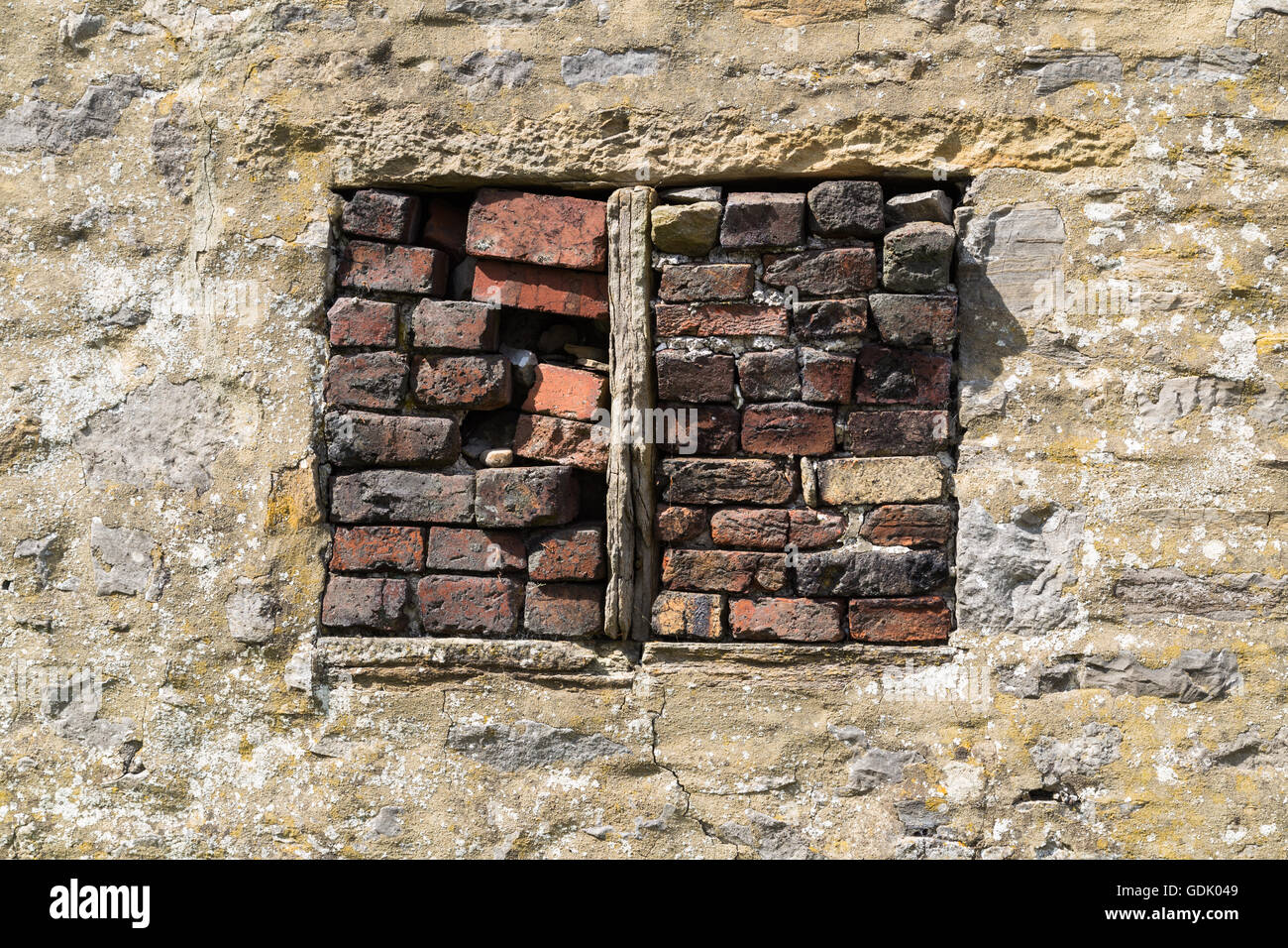 Bricked up window of stone barn, Stock Photo