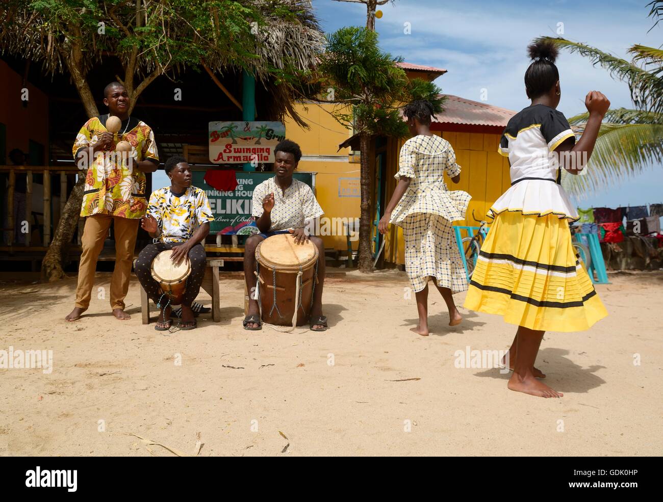 Hopkins Village, Belize - July 03, 2016: Garifuna troupe performs traditional songs with drumming and dancing in Hopkins Village Stock Photo