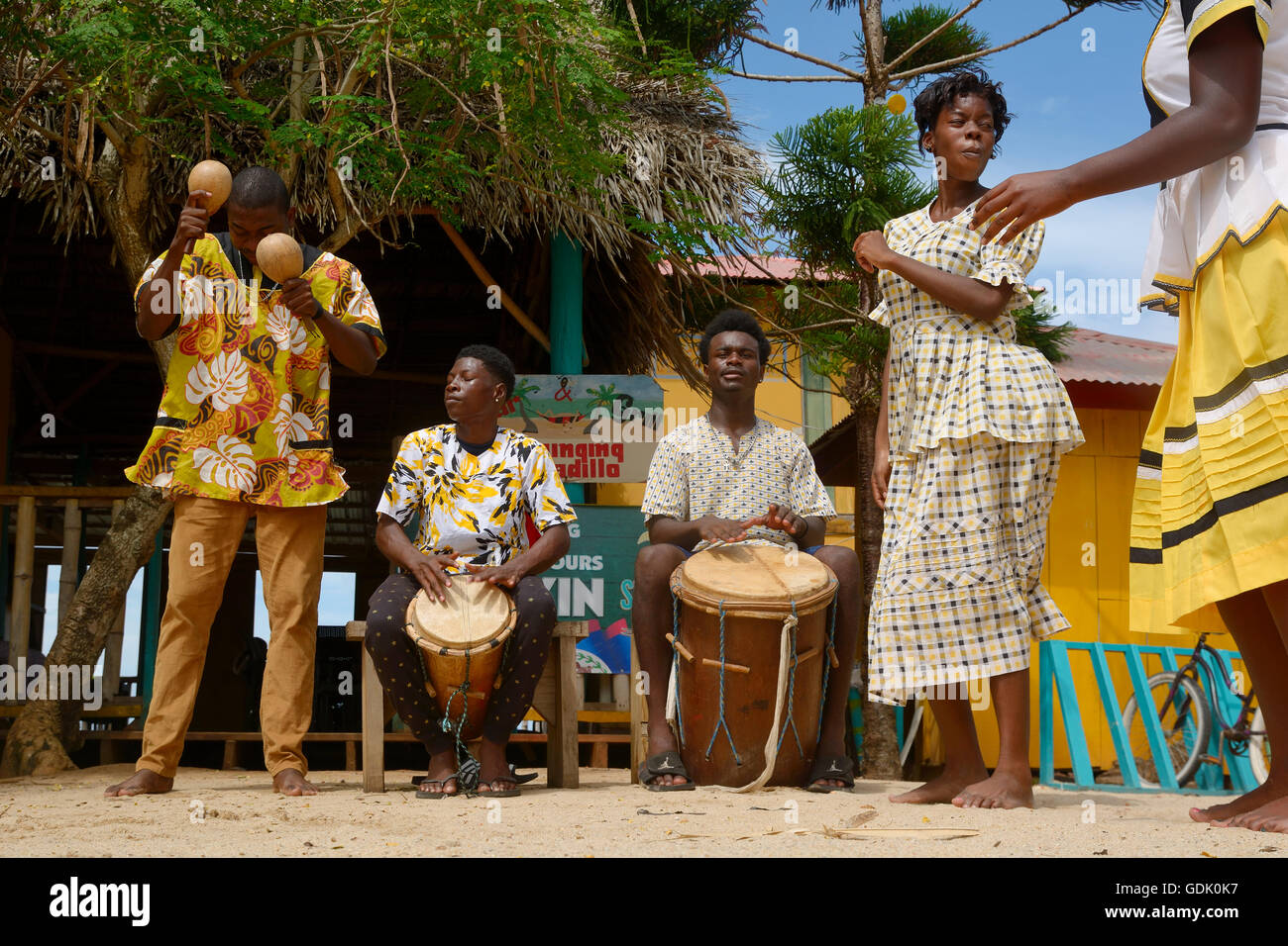 Hopkins Village, Belize - July 03, 2016: Garifuna troupe performs traditional songs with drumming and dancing in Hopkins Village Stock Photo