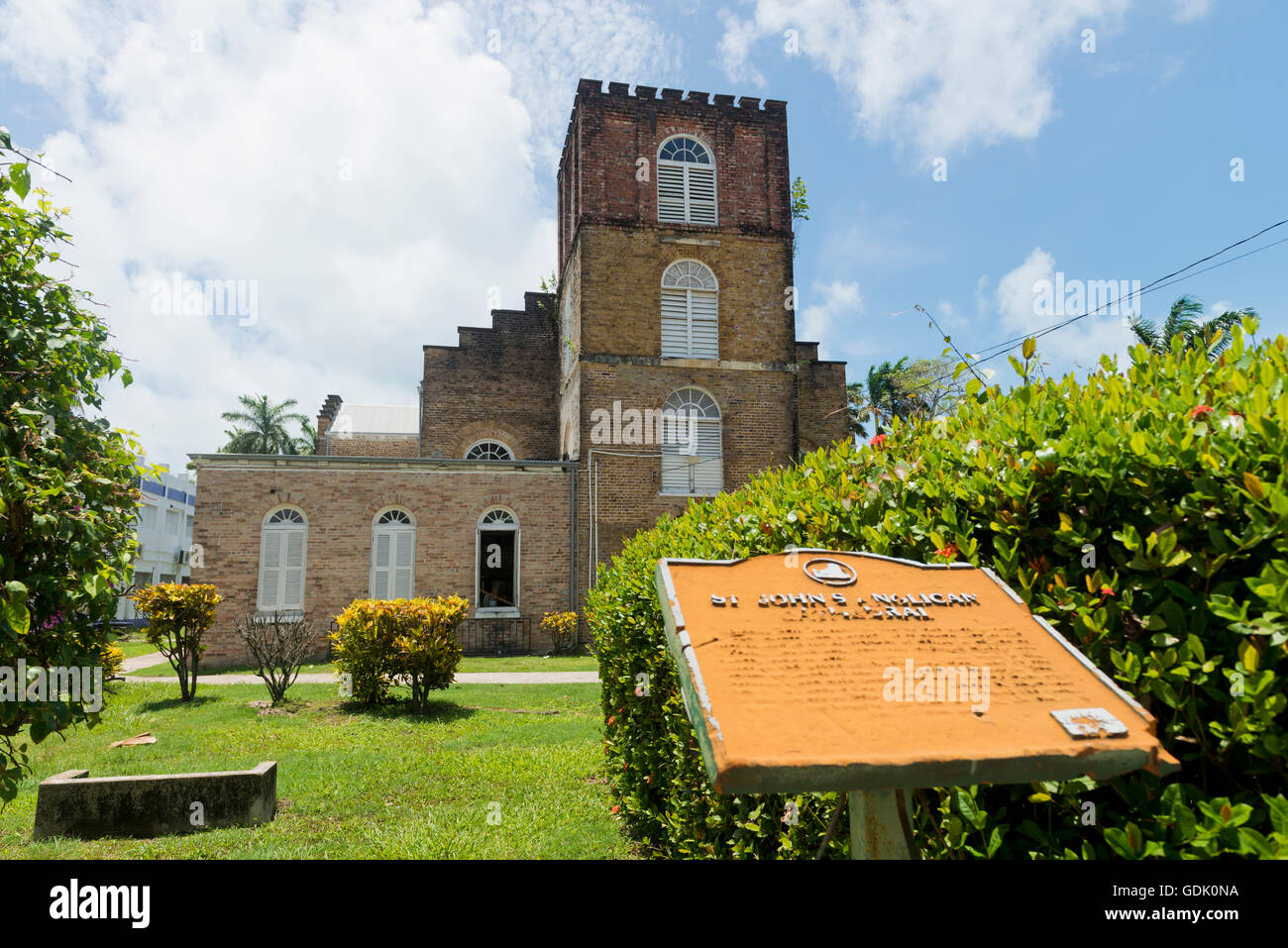 Belize City, Belize - June  24, 2016: Standing by the information panel in front of St John's Anglican Cathedral in Belize City. Stock Photo