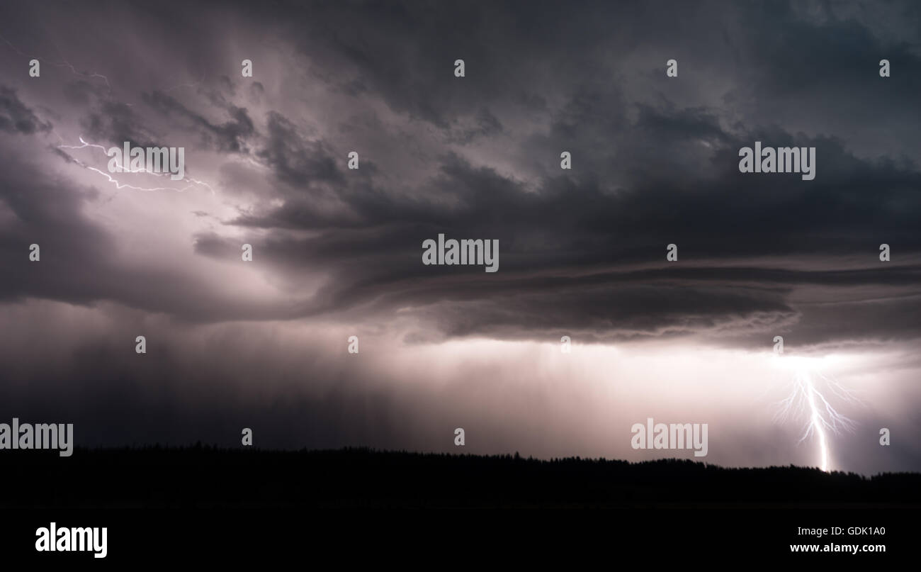 A large electrical storm passes over the forest near Canyon Village in Yellowstone Stock Photo