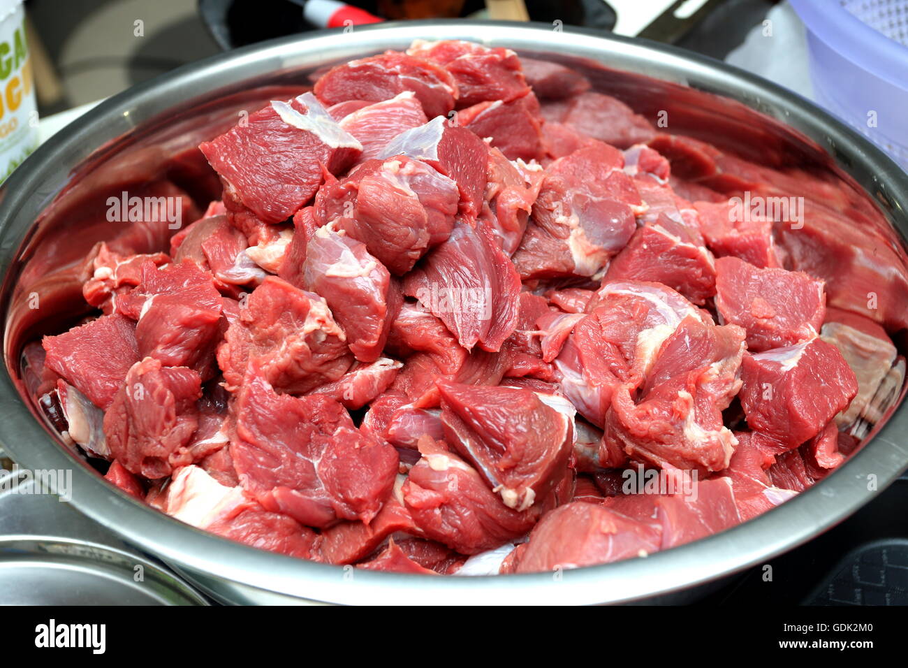 Freshly cut gravy beef in stainless steel bowl Stock Photo
