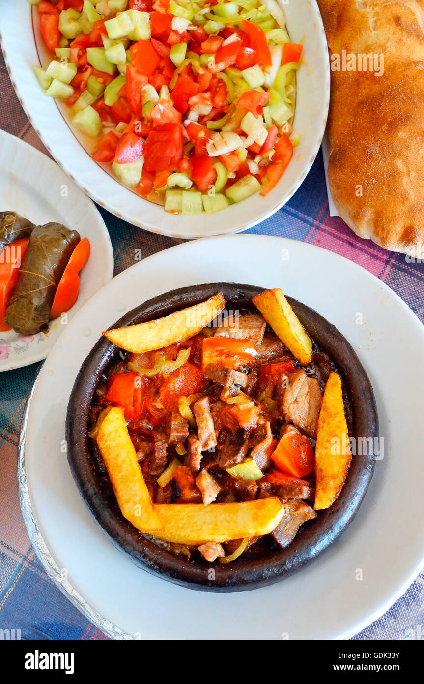 Guvec (vegetable and meat stew) with salad, Turkey Stock Photo - Alamy