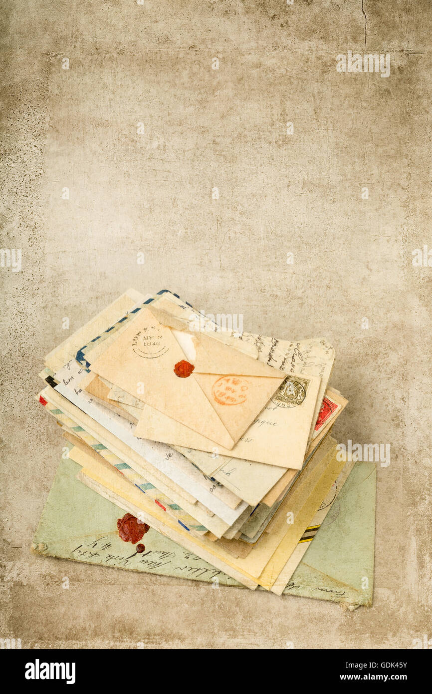Grungy textured background with antique old letters Stock Photo