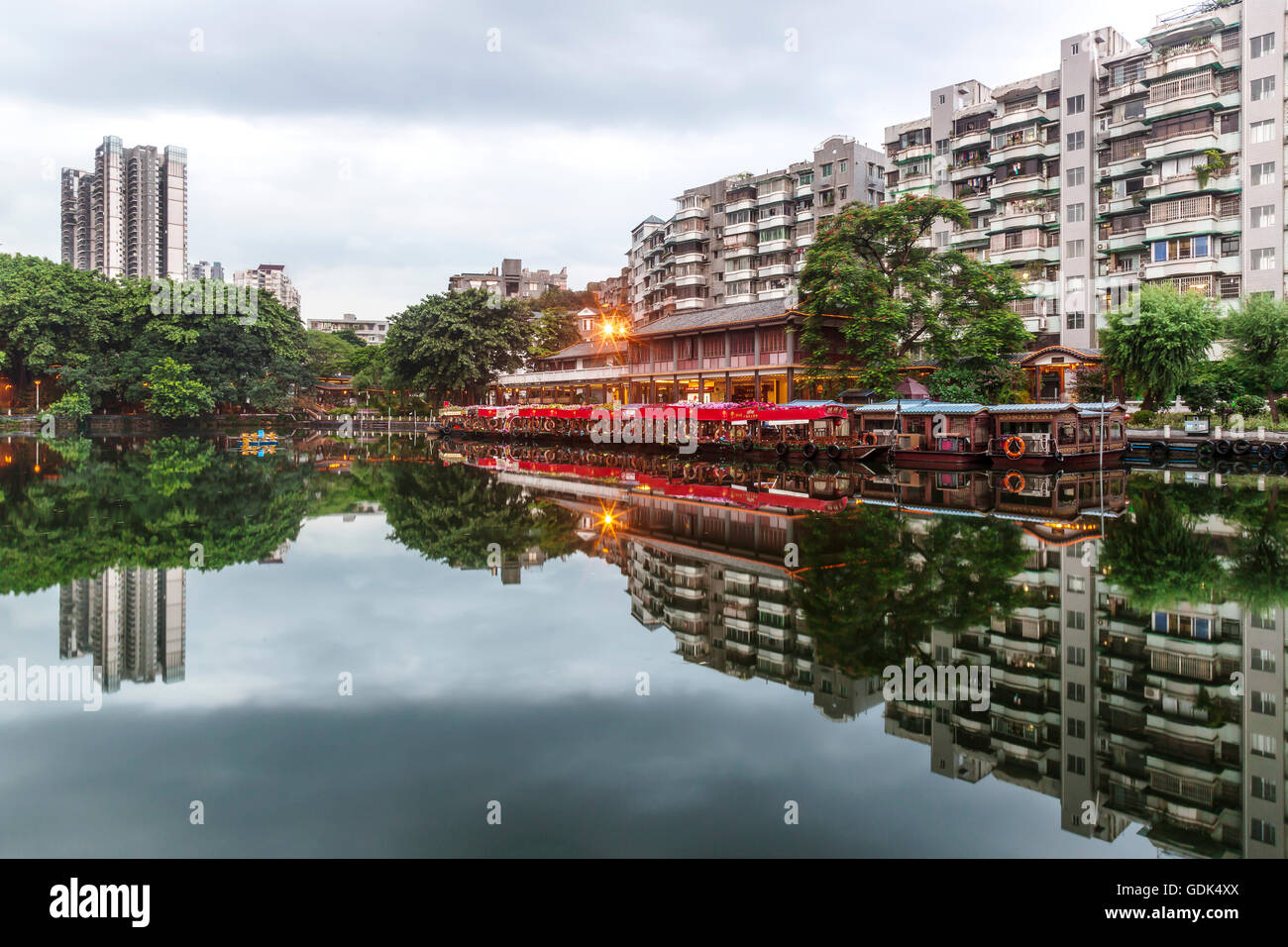 Skyline and reflexions of boats at Liwan Park, Guangzhou, China. Stock Photo