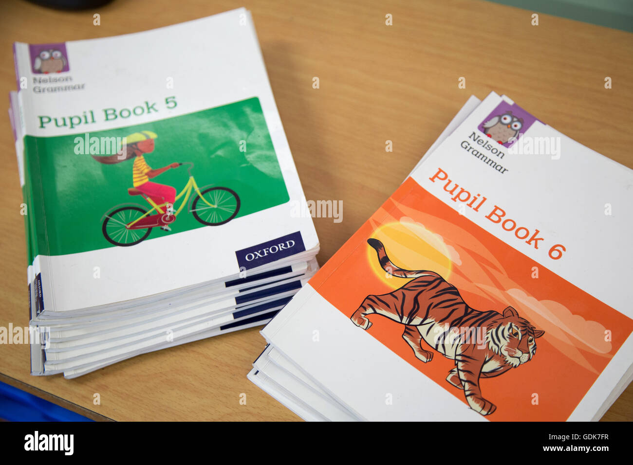 Two piles of UK primary school grammar text books Stock Photo