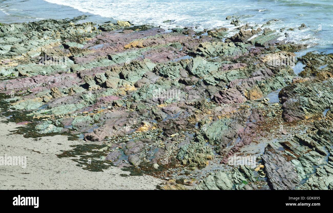 Colored rocks on Cornish sea shore Stock Photo - Alamy