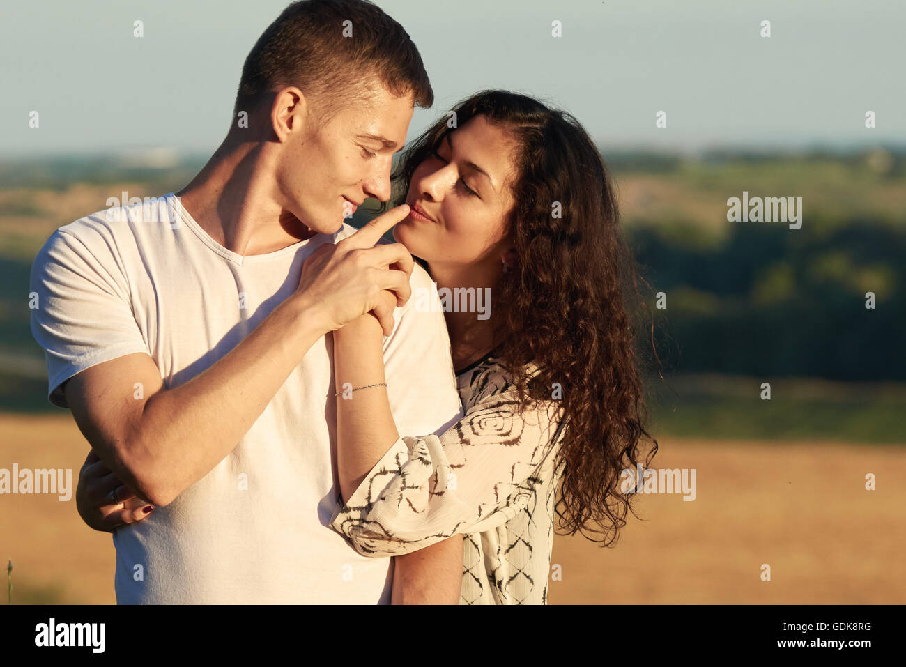 young couple posing high on country outdoor, romantic people love concept,  summer season Stock Photo - Alamy