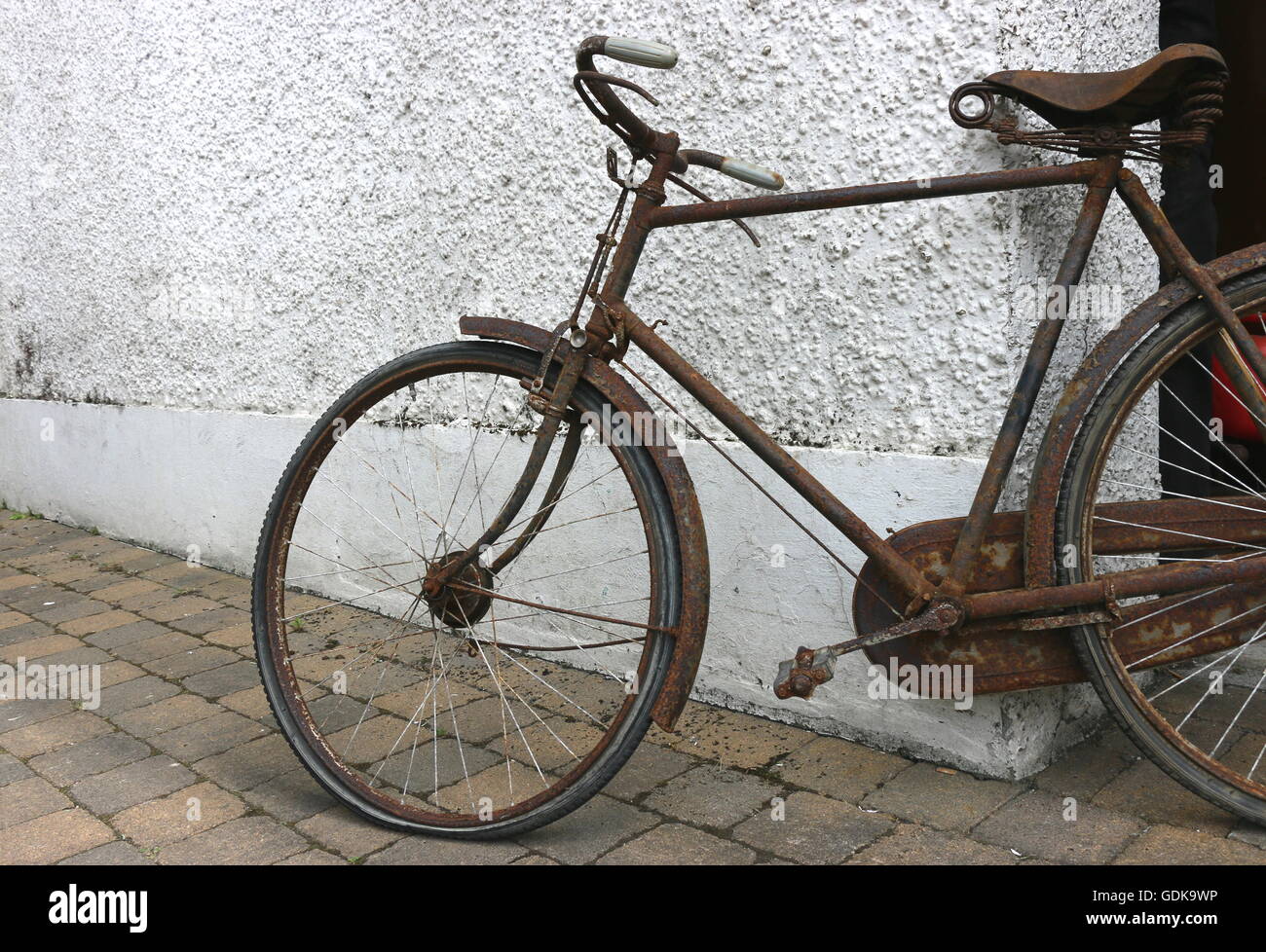 Rusty vintage bicycle outside an antique shop, The Netherlands. Stock Photo