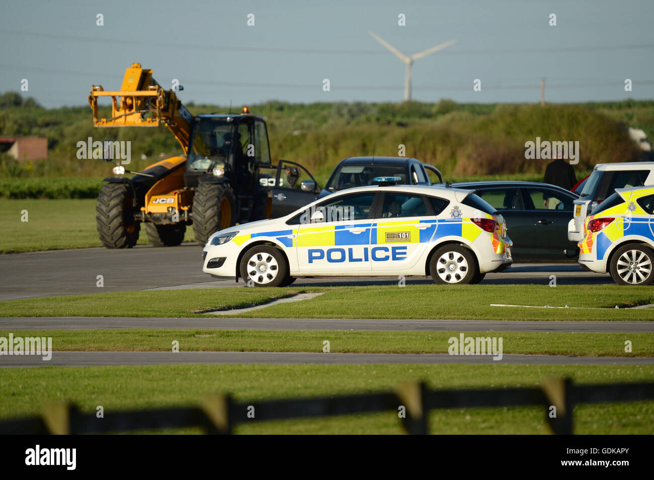 Police at the scene at Breighton airport near Selby, north Yorkshire, where five people have been seriously hurt in a helicopter crash at the aerodrome. Stock Photo