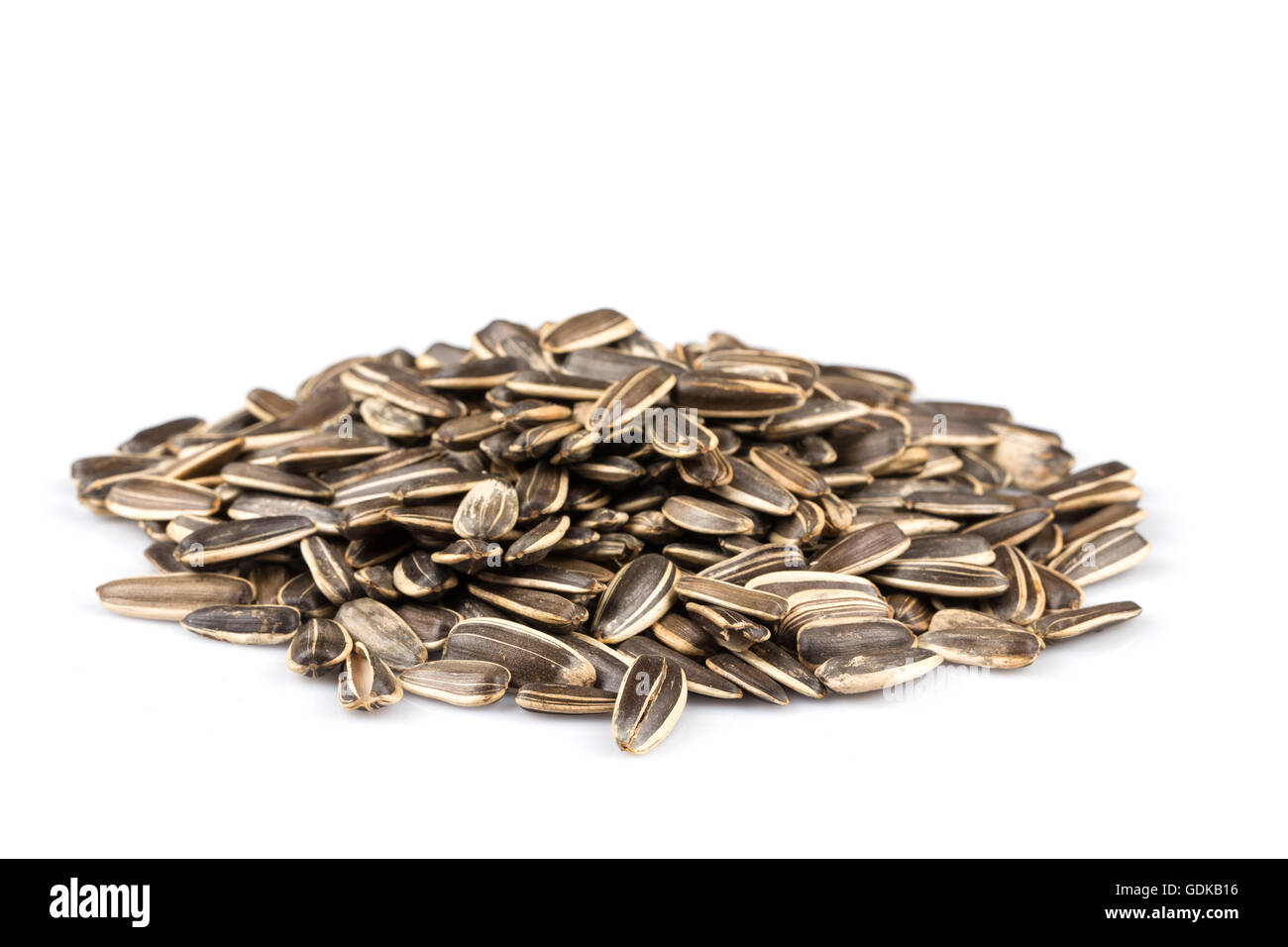 sunflower seeds pile isolated on white background Stock Photo - Alamy