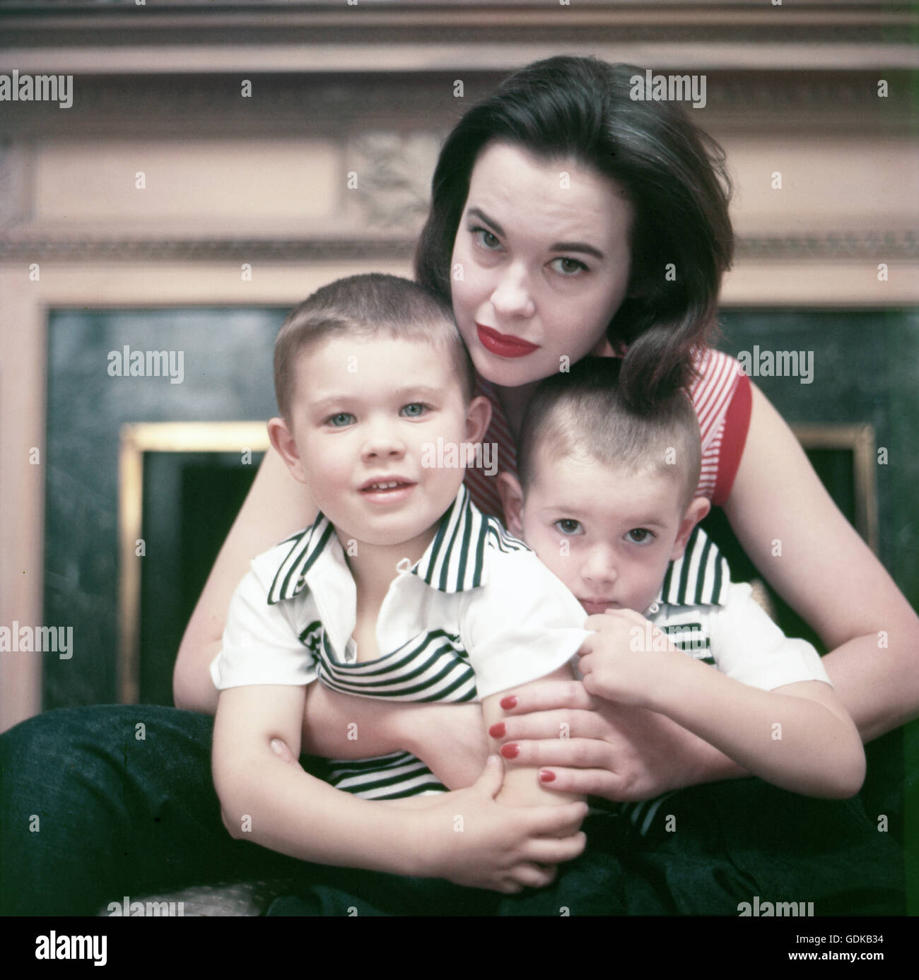 Gloria Vanderbilt, in 1955, holding her boys Stanislas and Christopher. Stock Photo
