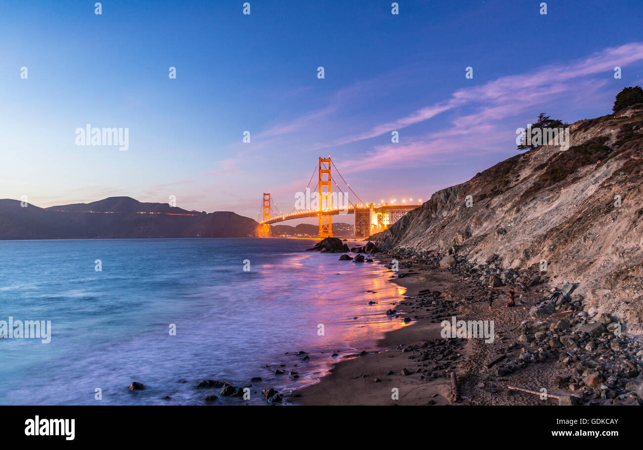 Golden Gate Bridge, evening light, Marshall's Beach, rocky coast, San Francisco, USA Stock Photo