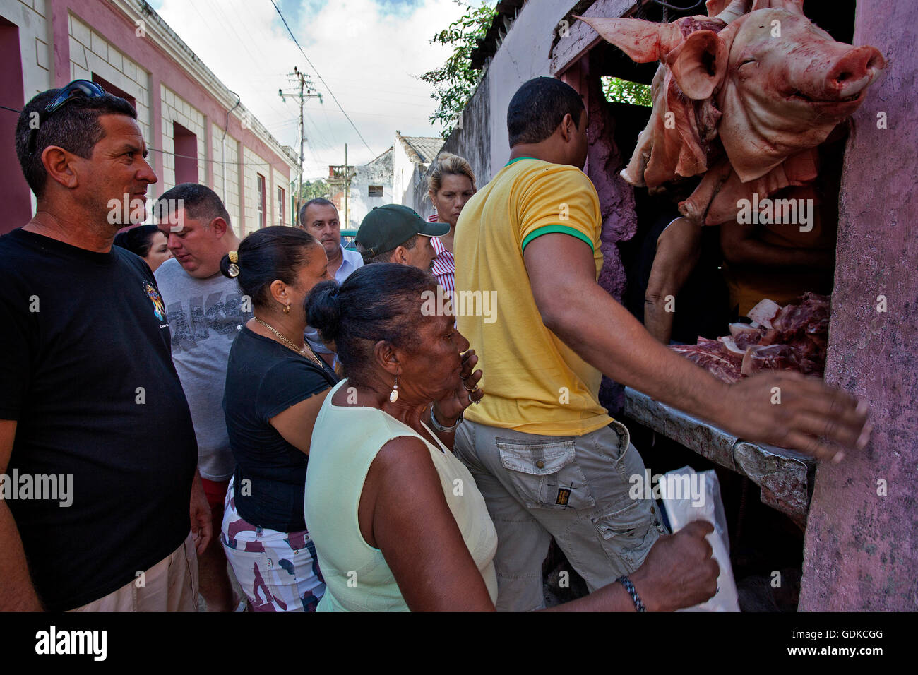 Locals at a sales stand with meat, on the street, Baracoa, Guantánamo Province, Cuba Stock Photo