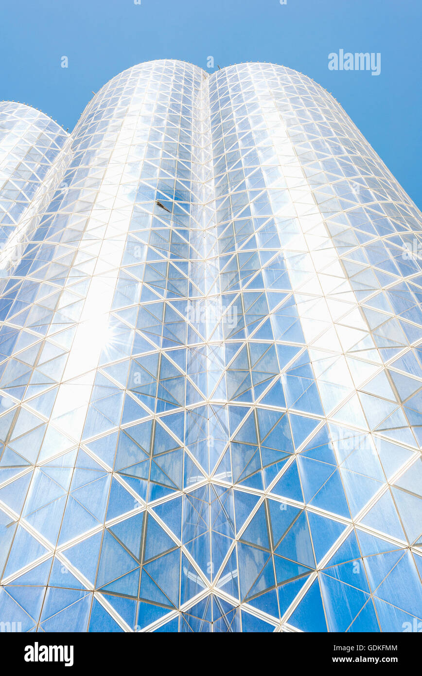 Facades of skyscrapers in Dubai with the blue glass exterior in bright sunlight. Stock Photo