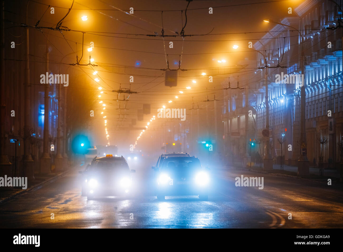 Gomel, Belarus - November 28, 2015: Night Traffic in fog On Lenin Avenue Stock Photo