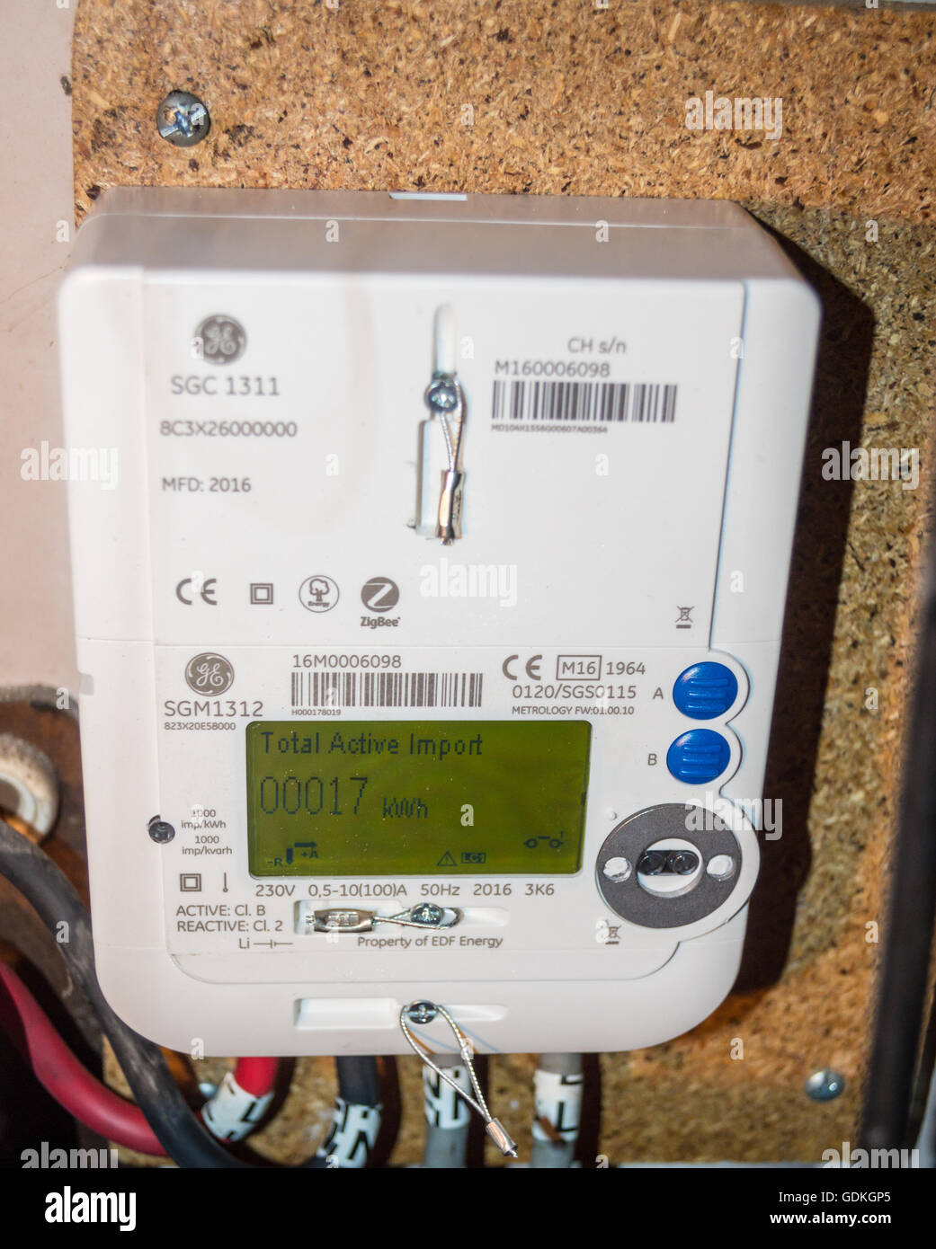 A newly installed EDF GE SGM1312 LCD display smart electricity meter  showing reading of 17kWh in a wine cellar in London England Stock Photo -  Alamy