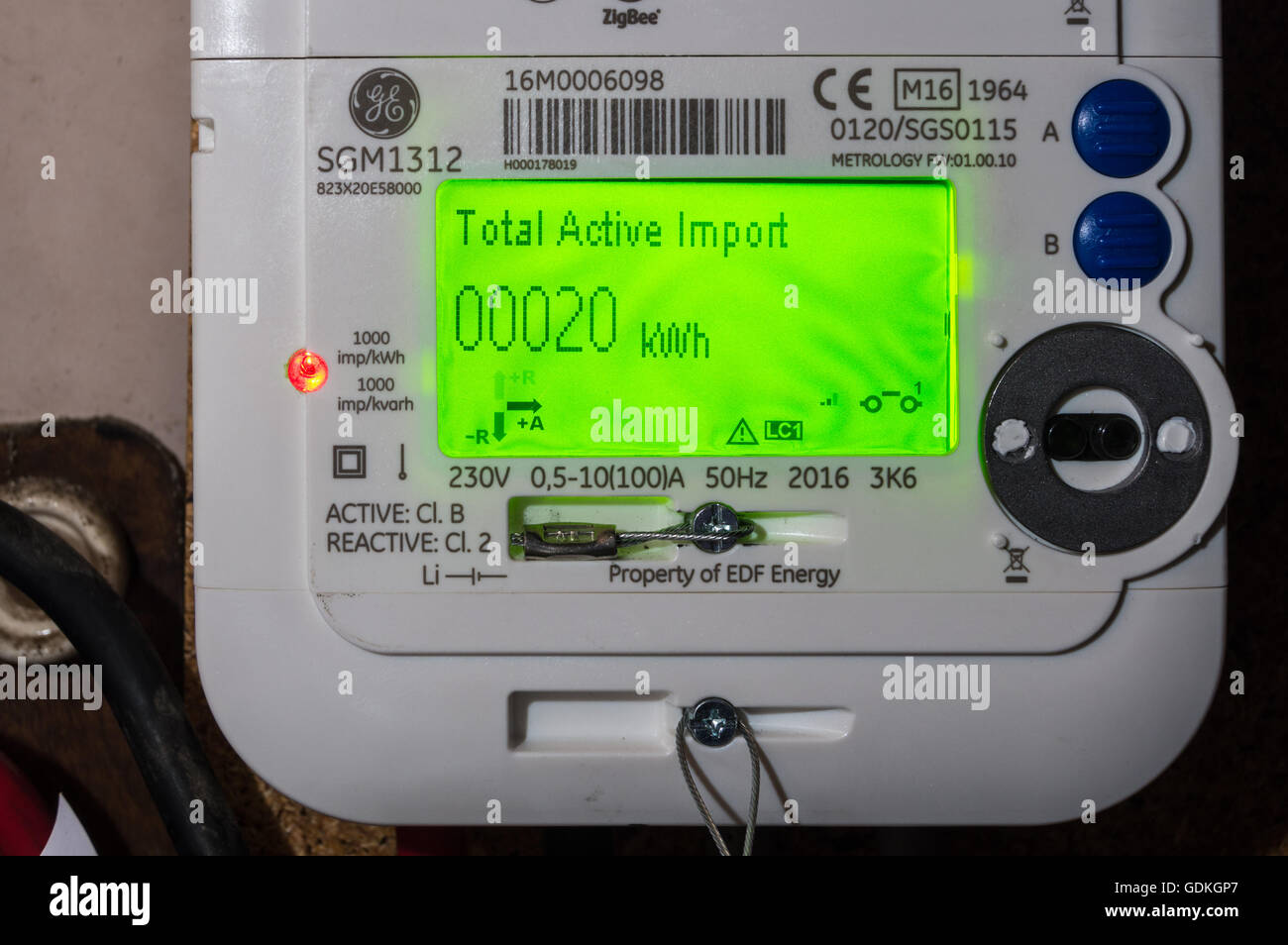 A newly installed EDF GE SGM1312 LCD display smart electricity meter  showing reading of 20kWh in a wine cellar in London England Stock Photo -  Alamy