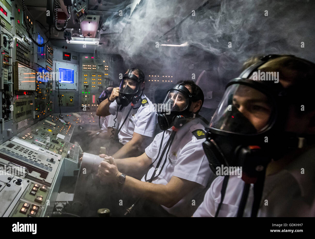 File photo dated 20/01/16 of members of the Royal Navy respond to a simulated fire in a Vanguard-class submarine control room simulator at a training facility in HM Naval Base Clyde, also known as Faslane, as Theresa May will tell MPs not to gamble with the safety of British families ahead of a Commons vote on whether to renew the Trident nuclear deterrent. Stock Photo