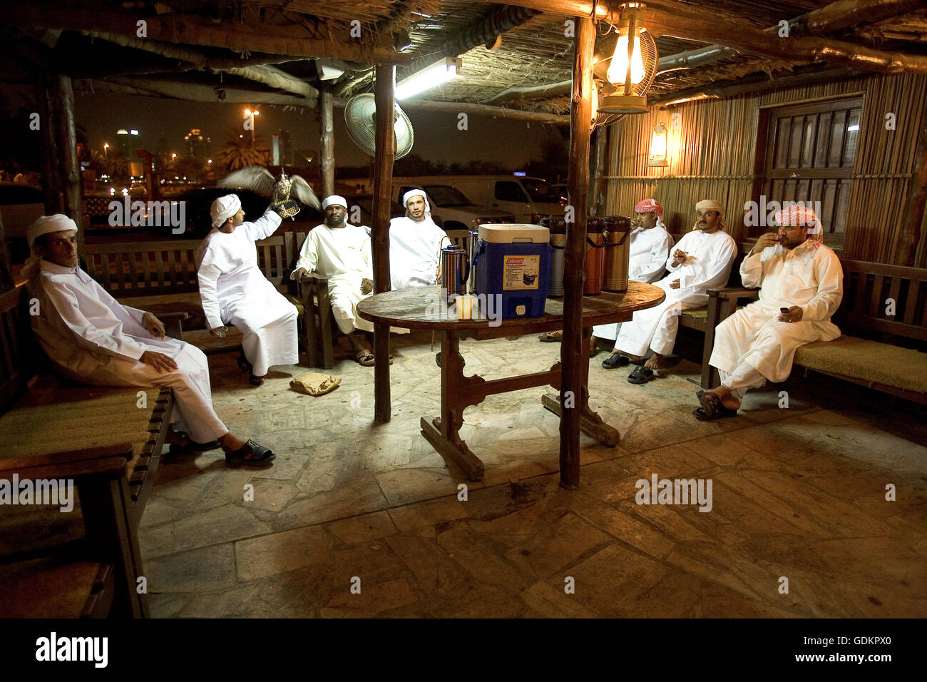 Arab men relax with a cup of tea, Dubai, UAE Stock Photo Alamy